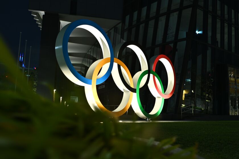 A night view of the closed Olympic museum with the Olympic Rings is seen in Tokyo on April 2, 2020. (Photo by Philip FONG / AFP) (Photo by PHILIP FONG/AFP via Getty Images)