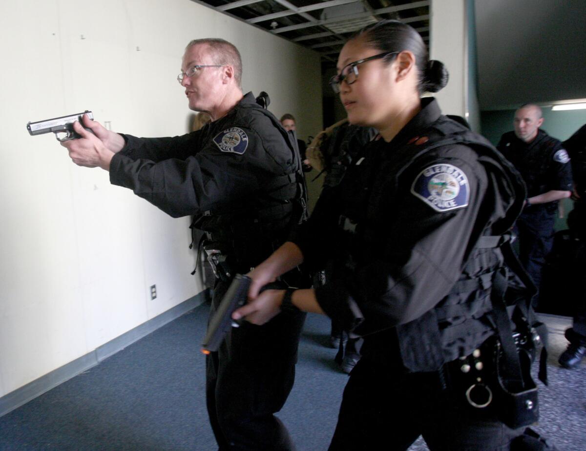 Glendale Police officers participate in live tactical medical training with the help of Hawthorne Police Department officers at the old Glendale Police Station building on Wednesday.