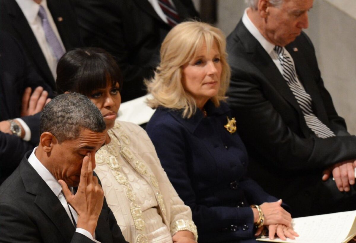 Jill Biden, second from right, sits with her husband, Vice President Joe Biden, and with President Obama and First Lady Michelle Obama at Washington National Cathedral on Tuesday.