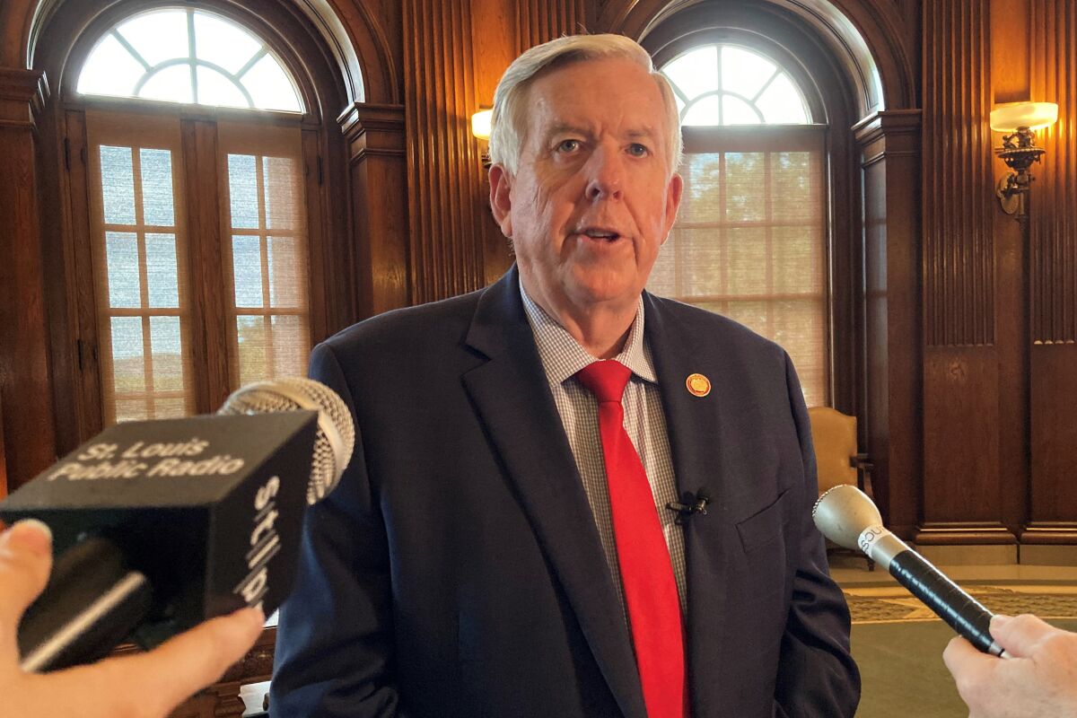 Missouri Gov. Mike Parson speaks to reporters after signing legislation redrawing the state's congressional districts on Wednesday, May 18, 2022, at the state Capitol in Jefferson City, Mo. The new map, to be used in this year's elections, is expected to shore up Republicans' 6-2 advantage over Democrats in the state's U.S. House delegation. (AP Photo/David A. Lieb)