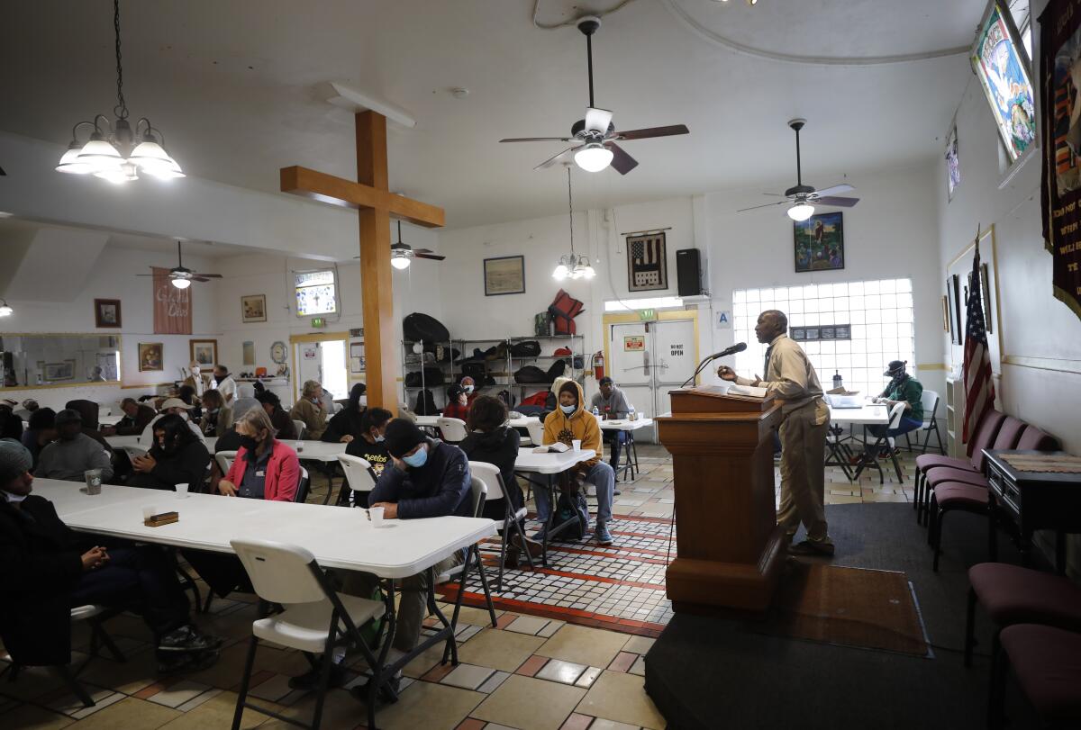 The Rev. Richard Daniels speaks a service at God's Extended Hand.