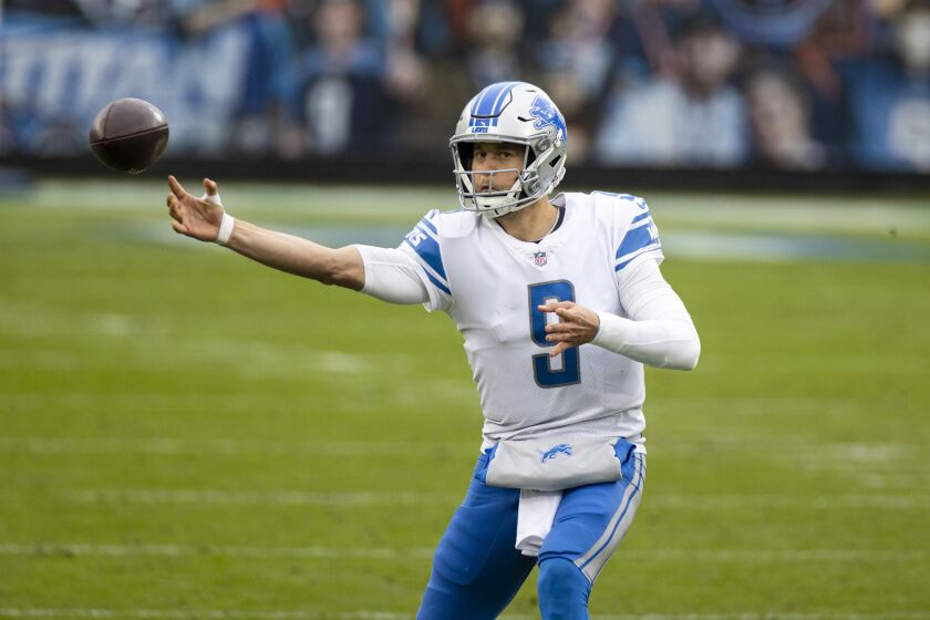 FILE - In this Dec. 20, 2020, file photo, Detroit Lions quarterback Matthew Stafford throws a pass during the second quarter of the team's NFL football game against the Tennessee Titans in Nashville, Tenn. One after another, quarterbacks once believed to be franchise cornerstones after being top five picks changed addresses this offseason in staggering succession. Stafford and Jared Goff switched teams in a swap of former No. 1 overall picks. (AP Photo/Brett Carlsen, File)