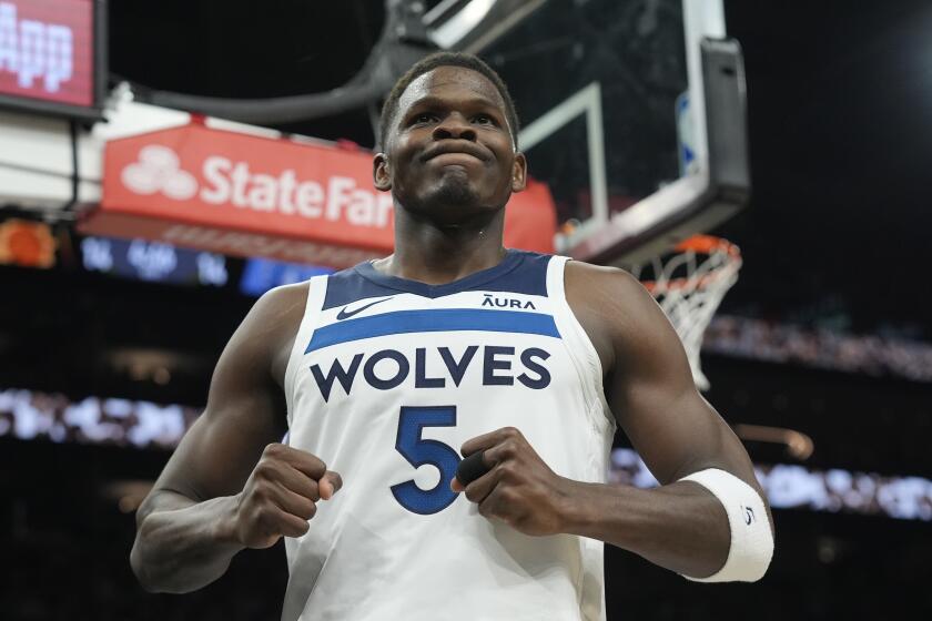 Minnesota Timberwolves guard Anthony Edwards celebrates a foul against the Phoenix Suns during the first half of Game 4 of an NBA basketball first-round playoff series, Sunday, April 28, 2024, in Phoenix. The Timberwolves won 122-116, taking the series 4-0. (AP Photo/Ross D. Franklin)