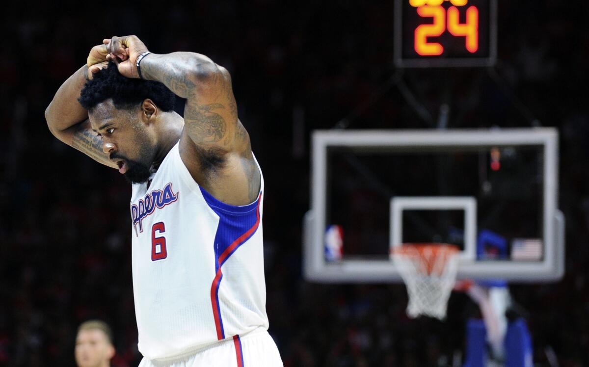 Center DeAndre Jordan walks off the court late in the Clippers' Game 2 loss to the Spurs.
