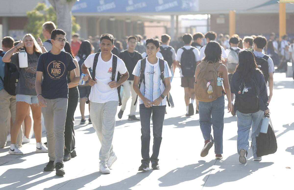 Students find their class on the first day of school at Fountain Valley High on Wednesday.