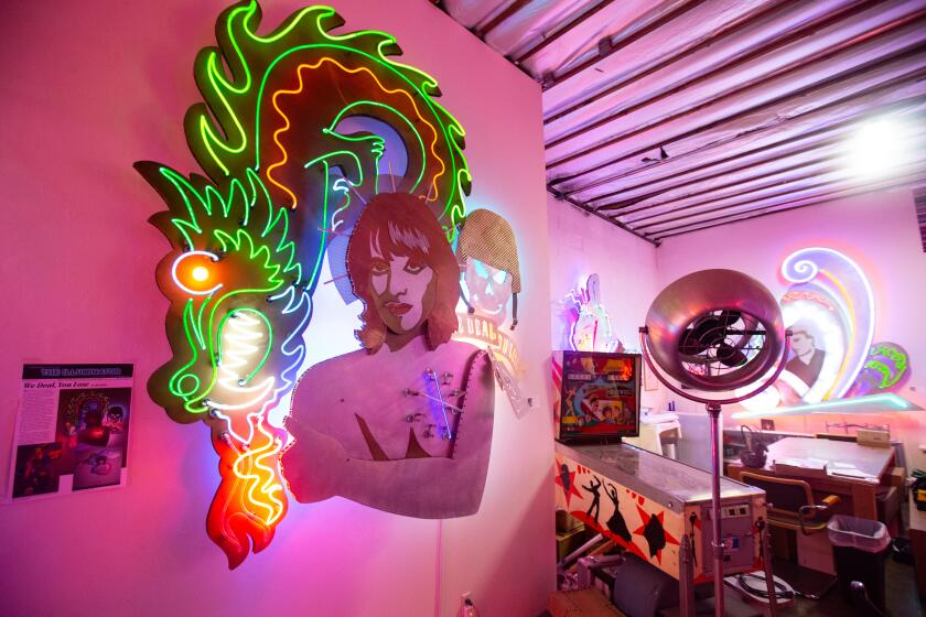 Los Angeles, CA., December 4, 2019: Lakich Neon Studio and Gallery on Wednesday December 4, 2019. Lilli Lakich is an amazing and prolific neon artist who has lived in the Arts District for many decades. Her unassuming studio in the middle of town doubles as a gallery, housing large scale works spanning from the 1970s to 2019. Four hours in downtown Los Angeles' Arts District features a wide variety of eclectic destinations that are great to visit on Wednesday December 4, 2019. (Jason Armond / Los Angeles Times)