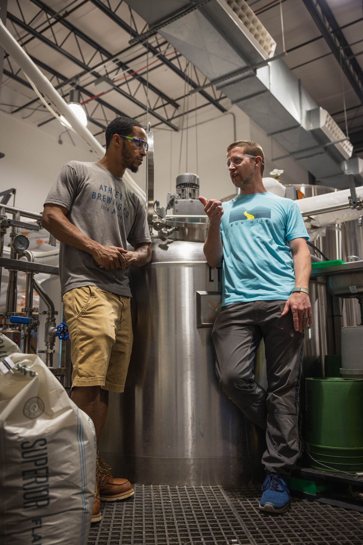 Athletic Brewing Company's 2021 scholarship winner Oren Ferris, left, with Athletic's co-founder and head brewer John Walker.