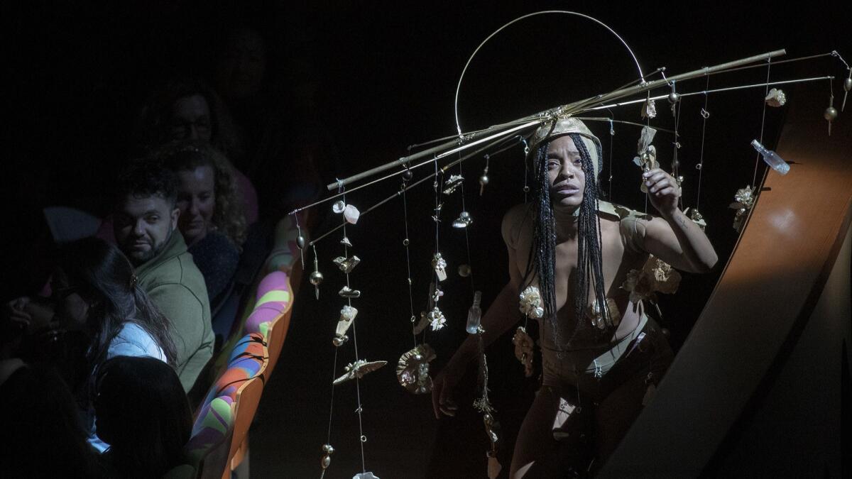 Dancer Brooke Shepard performs Yoko Ono's "Dance Piece IX: A," choreographed by Nina McNeely, at Walt Disney Concert Hall.