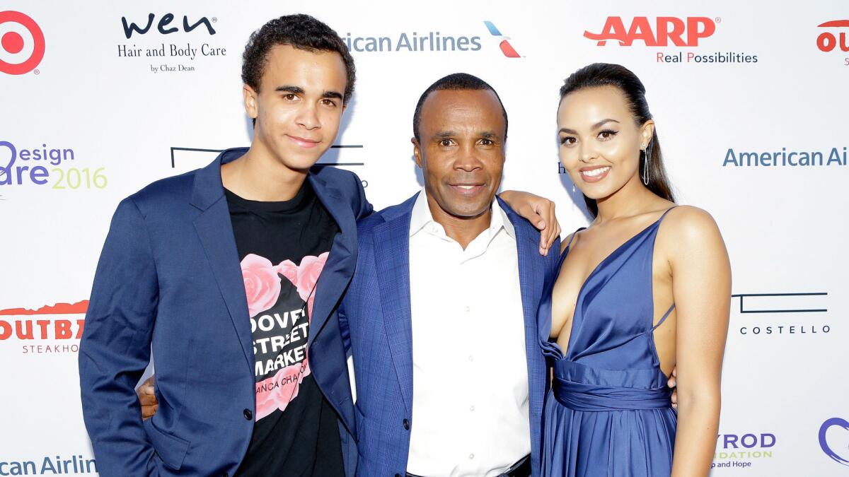 Daniel Ray Leonard, left, Sugar Ray Leonard and Camille Leonard stop on the red carpet at HollyRod Foundation's DesignCare Gala.