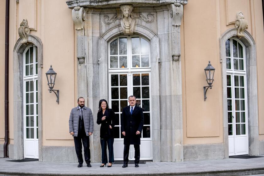 German Foreign Minister Annalena Baerbock, centre, welcomes Armenia's Foreign Minister Ararat Mirzoyan, left, and Azerbaijan's Foreign Minister Jeyhun Bayramov for peace talks in the Villa Borsig in Berlin, Germany, Wednesday, Feb. 28, 2024. (AP Photo/Ebrahim Noroozi)
