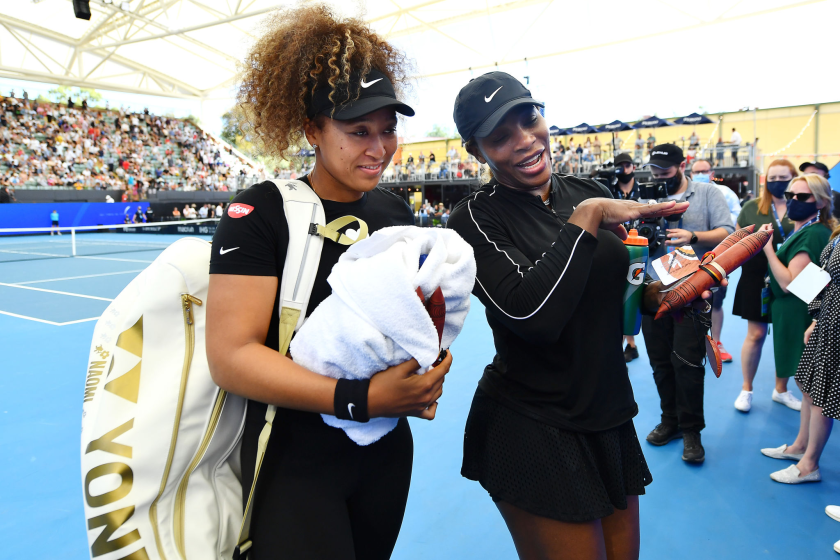 Naomi Osaka and Serena Williams of the USA leave the court after an exibition match January 29 in Adelaide, Australia.
