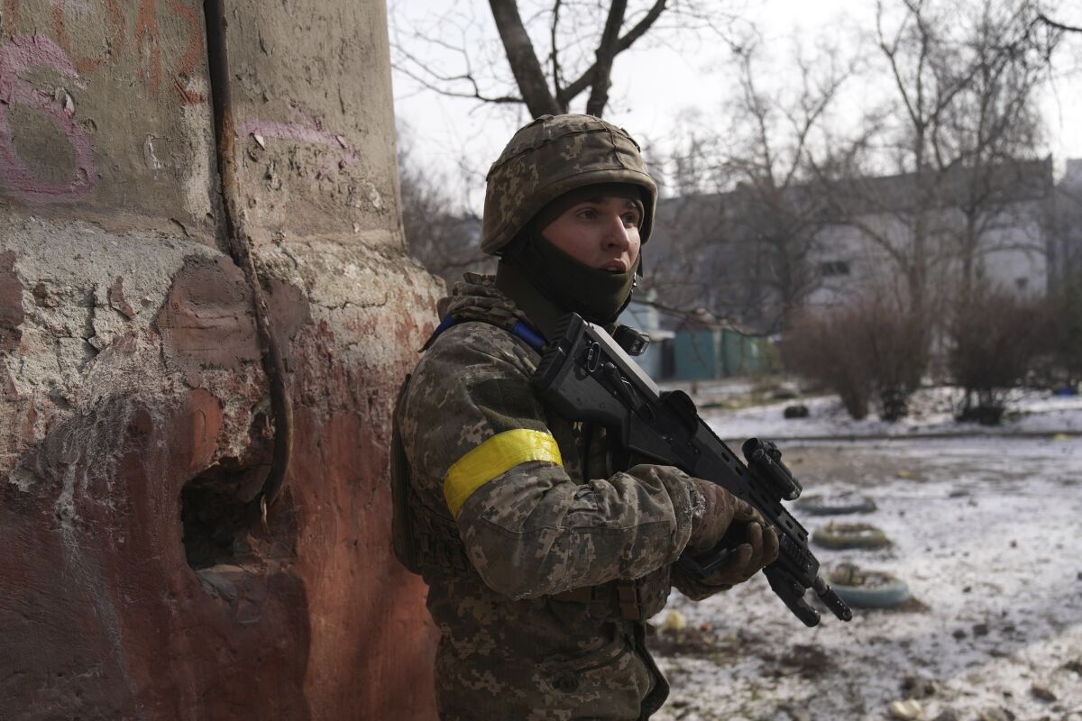 A Ukrainian serviceman guards his position in Mariupol, Ukraine, Saturday, March 12, 2022. Ukraine’s military says Russian forces have captured the eastern outskirts of the besieged city of Mariupol. In a Facebook update Saturday, the military said the capture of Mariupol and Severodonetsk in the east were a priority for Russian forces. Mariupol has been under siege for over a week, with no electricity, gas or water. (AP Photo/Evgeniy Maloletka)