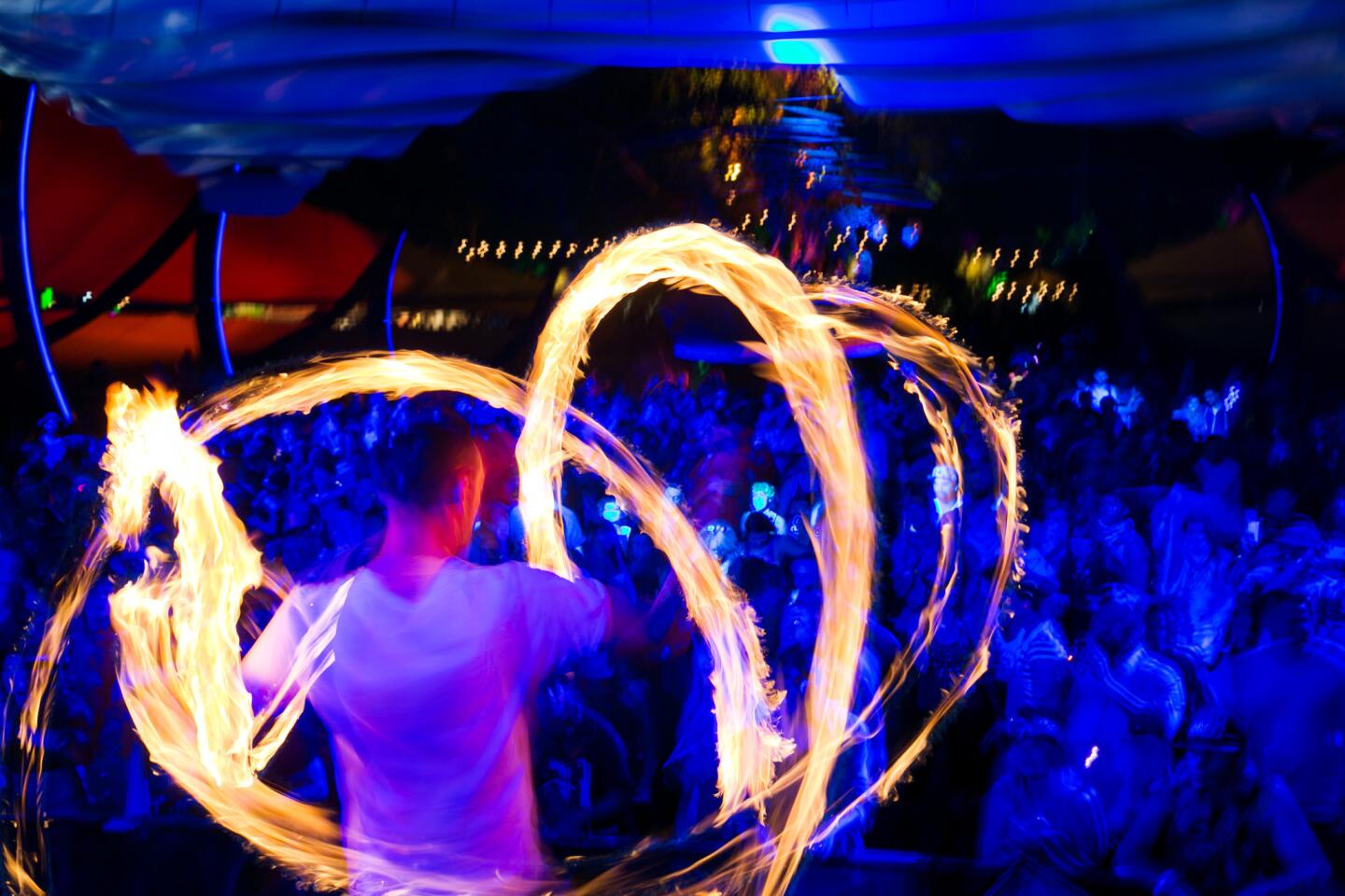 Fire dancers entertain the crowd at the DO Lab on Day 2 at Coachella.