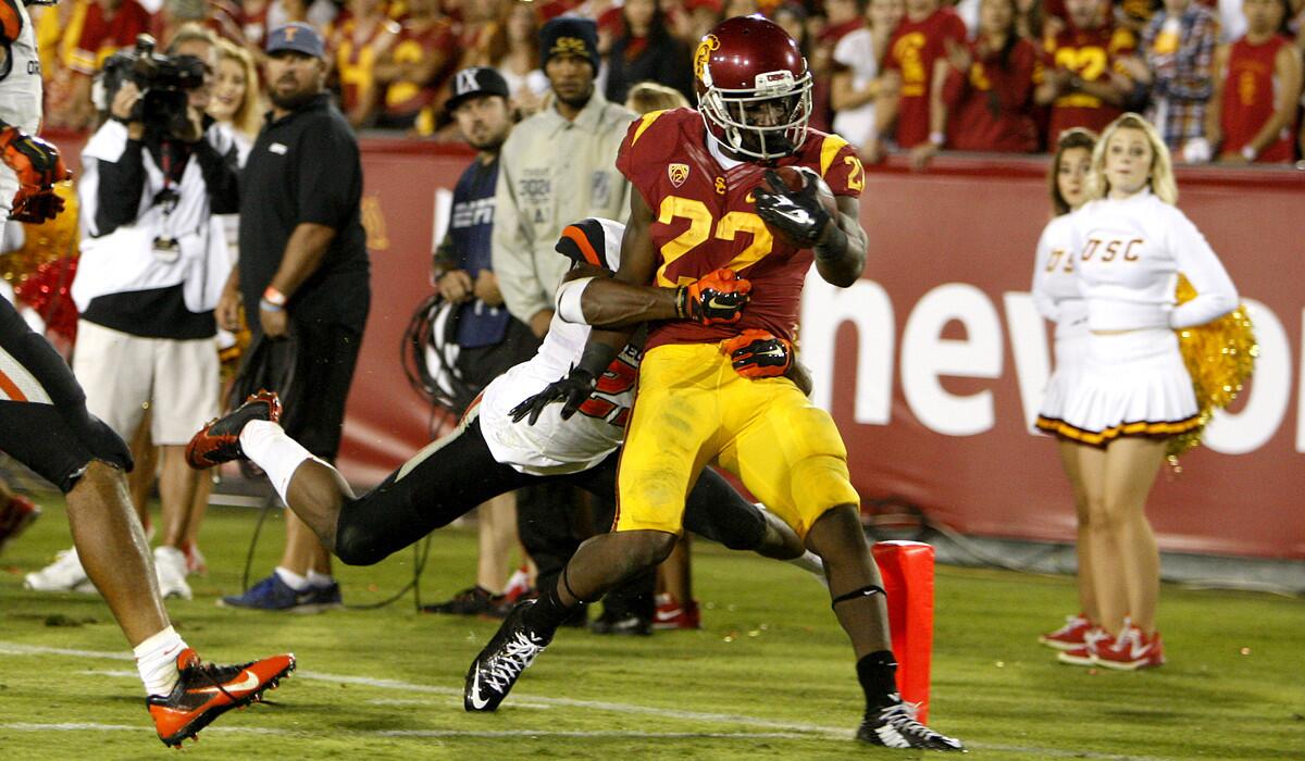 USC running back Justin Davis beats Oregon State safety Ryan Murphy to the goal line on a 21-yard scoring run in the fourth quarter Saturday night at the Coliseum.