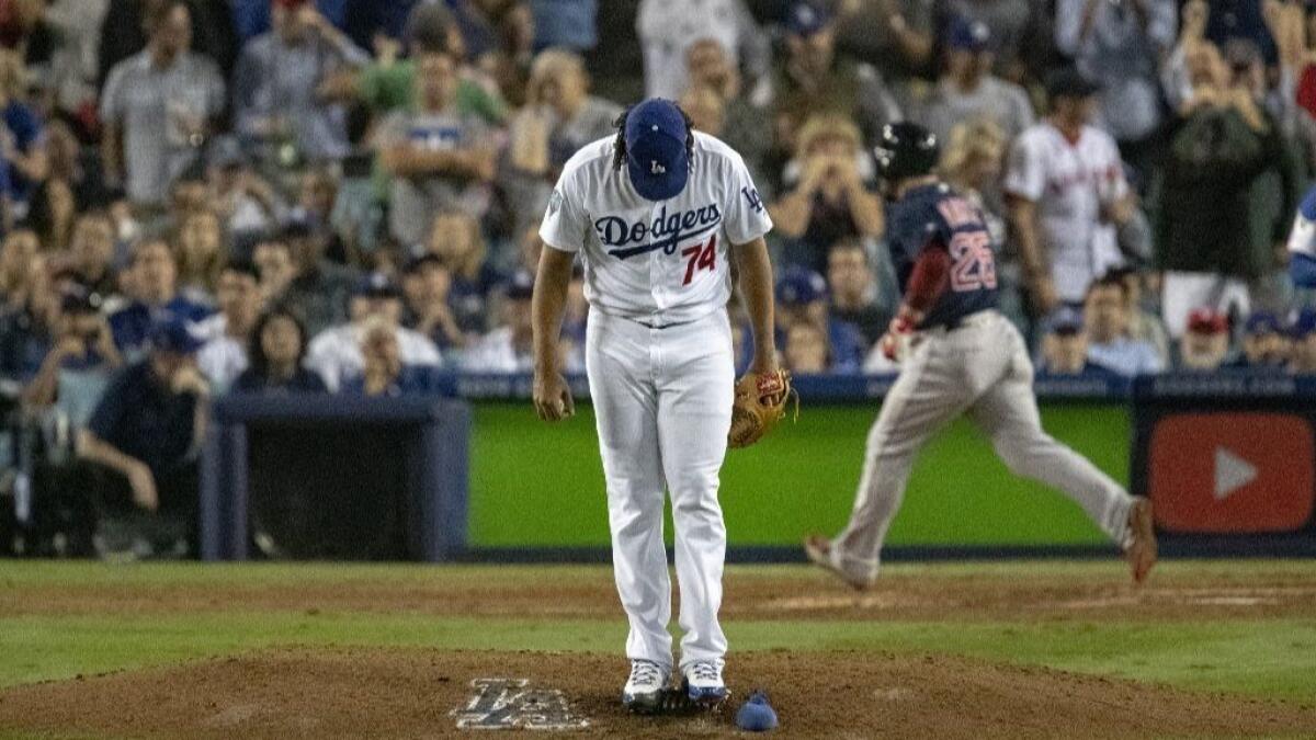 Dodgers pitcher Kenley Jansen (74) looks down at the mound after giving up the tying run to Boston Red Sox first baseman Steve Pearce (25) in the eighth inning during Game 4 of the World Series at Dodger Stadium on October 27, 2018.