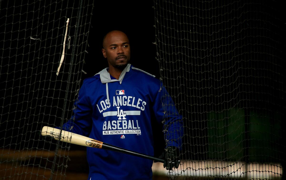 Dodgers infielder Jimmy Rollins takes batting practice during spring training in Glendale, Ariz., on March 2.
