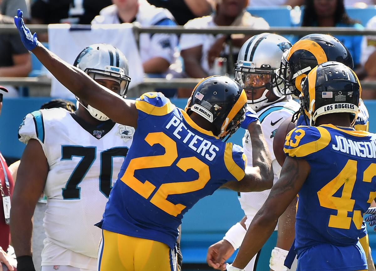 Rams cornerback Marcus Peters taunts Panthers quarterback Cam Newton after an interception by teammate Cory Littleton during the fourth quarter.
