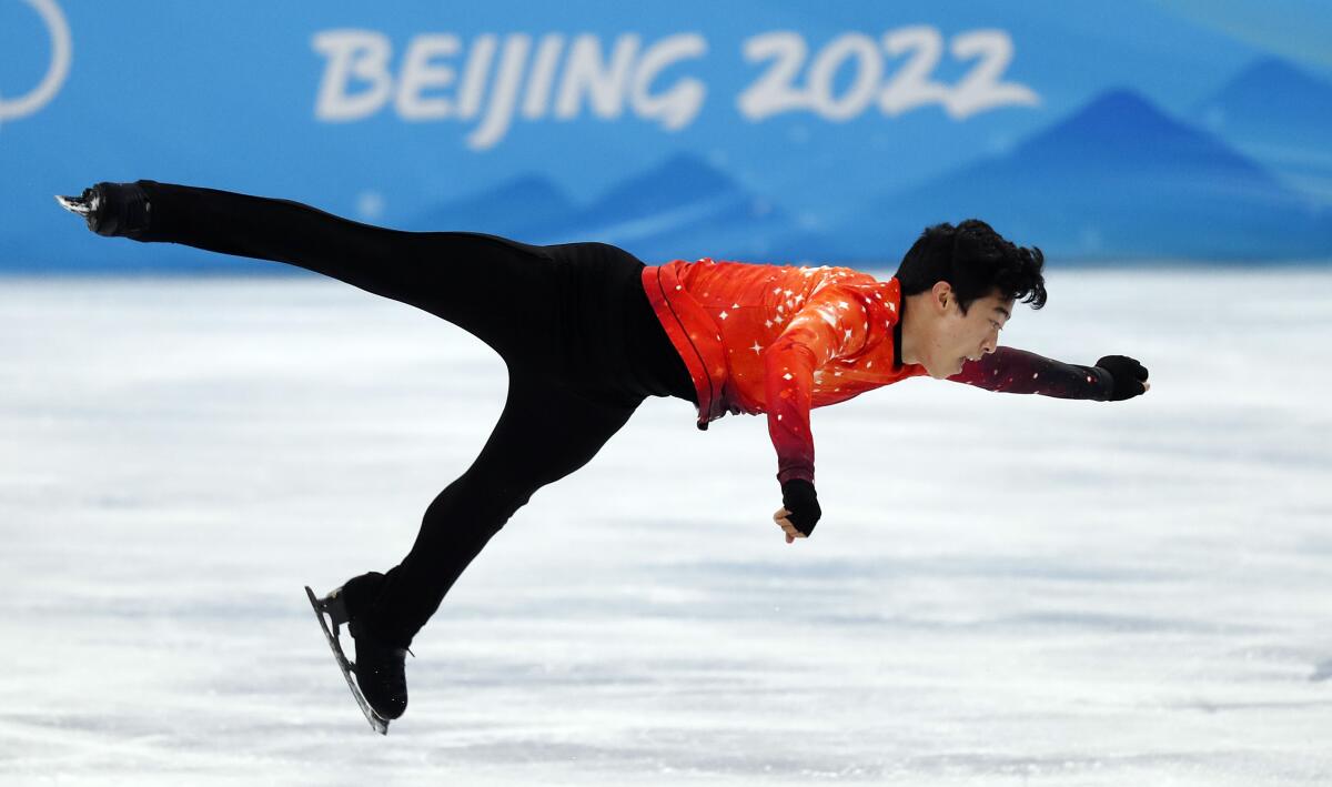 Nathan Chen performs during the men's individual competition at the Beijing Olympics on Thursday.