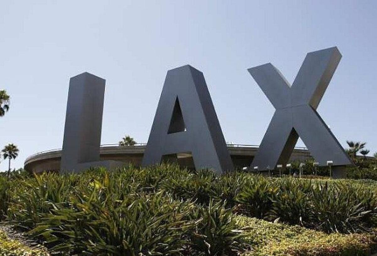 The initials greeting arrivals at an entrance to LAX.