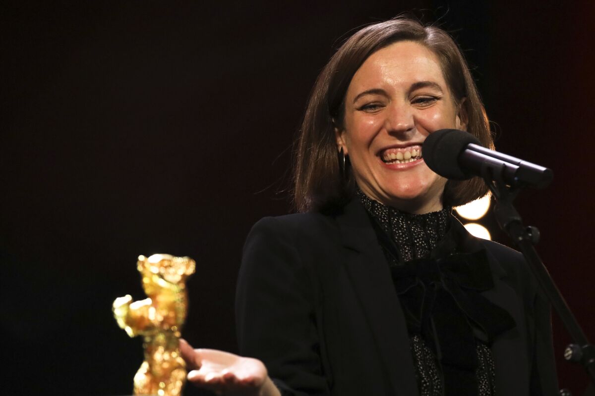 Carla Simon receives the Golden Bear for best film for her movie 'Alcarras' during the awarding ceremony at the International Film Festival Berlin 'Berlinale', in Berlin, Germany, Wednesday, Feb. 16, 2022. (Photo by Vianney Le Caer/Invision/AP)