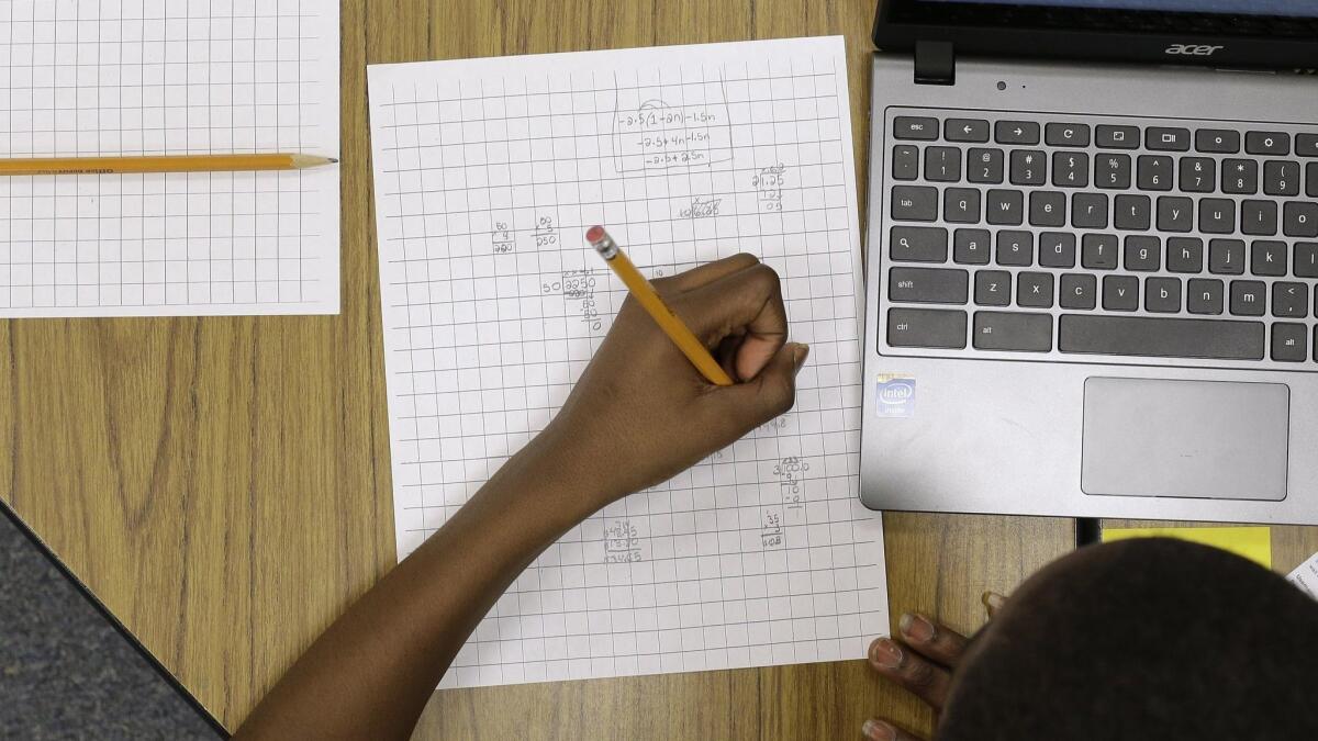 A student works on math problems in Annapolis, Md. on Feb. 12, 2015.