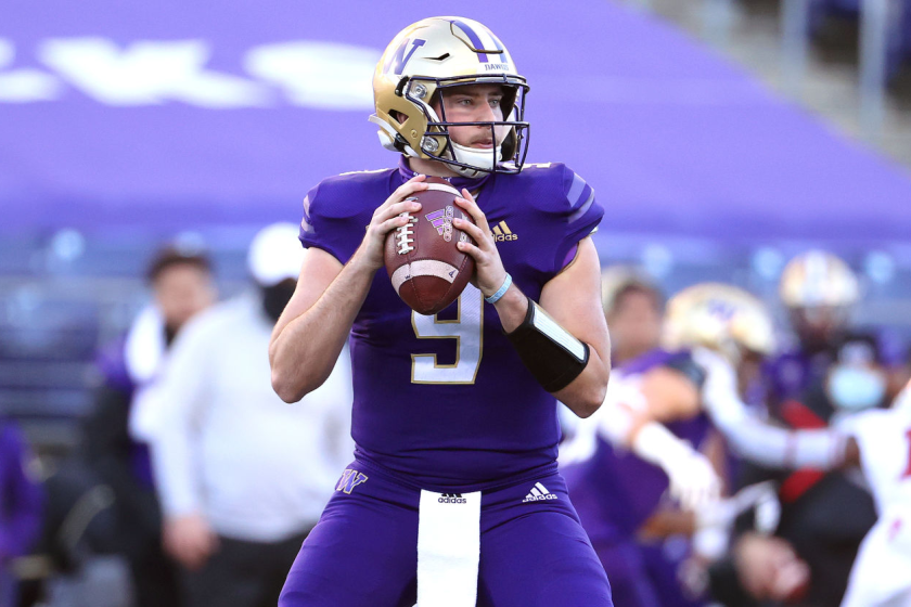 SEATTLE, WASHINGTON - DECEMBER 05: Dylan Morris #9 of the Washington Huskies looks to throw the ball.