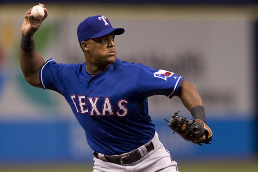 Texas Rangers third baseman Adrian Beltre makes a throw during a game against the Tampa Bay Rays on April 5. The Rangers placed Beltre on the disabled list Sunday.