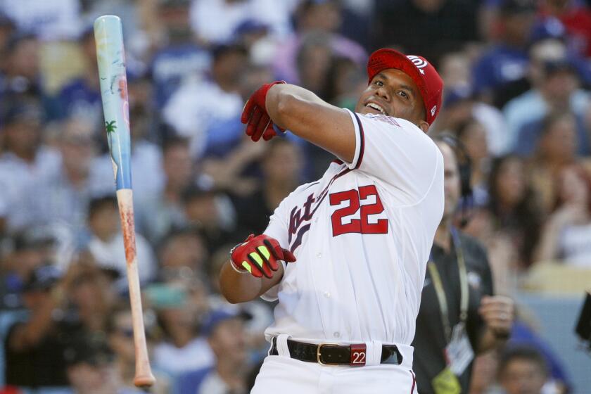 LOS ANGELES, CA - JULY 18: Washington Nationals' Juan Soto tosses his bat after defeating Cleveland.