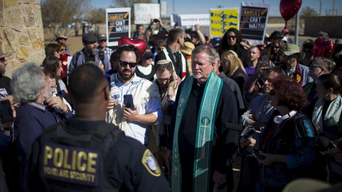 Faith leaders talk with a Department of Homeland Security official outside the Tornillo detention camp holding more than 2,300 migrant teens in Tornillo, Texas, on Nov. 15, 2018.