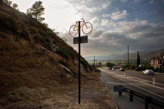 SUNLAND, CA - APRIL 10: A memorial to Jeff Knopp, who was killed riding his bike in 2016, reminds drivers to stay focused on Sunday, April 10, 2022 in Sunland, CA. {({photographer} / Los Angeles Times)