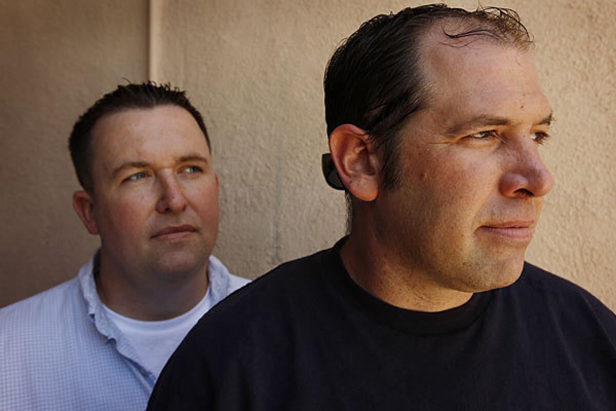 Veteran Greg Valentini, right, is shown with social worker Jim Zenner in 2011.