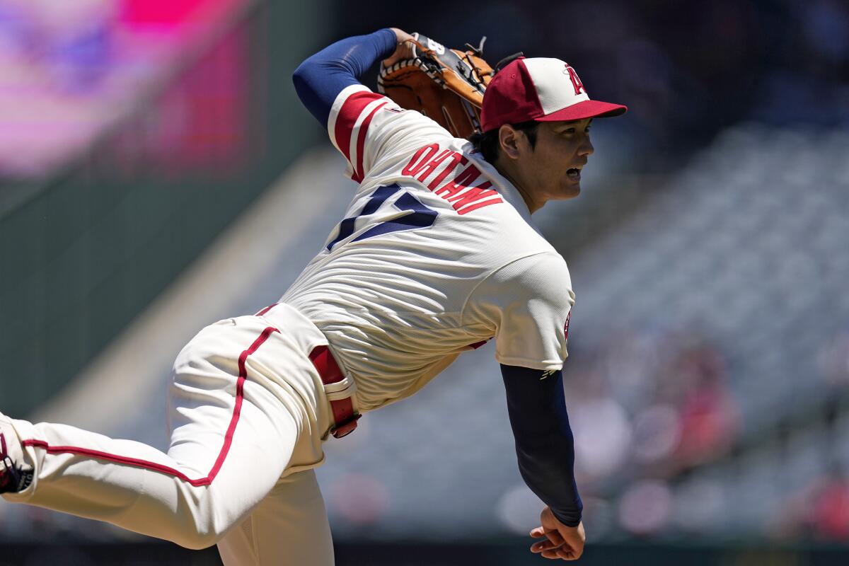 Angels starting pitcher Shohei Ohtani throws to the plate during the first inning against the Reds Wednesday.