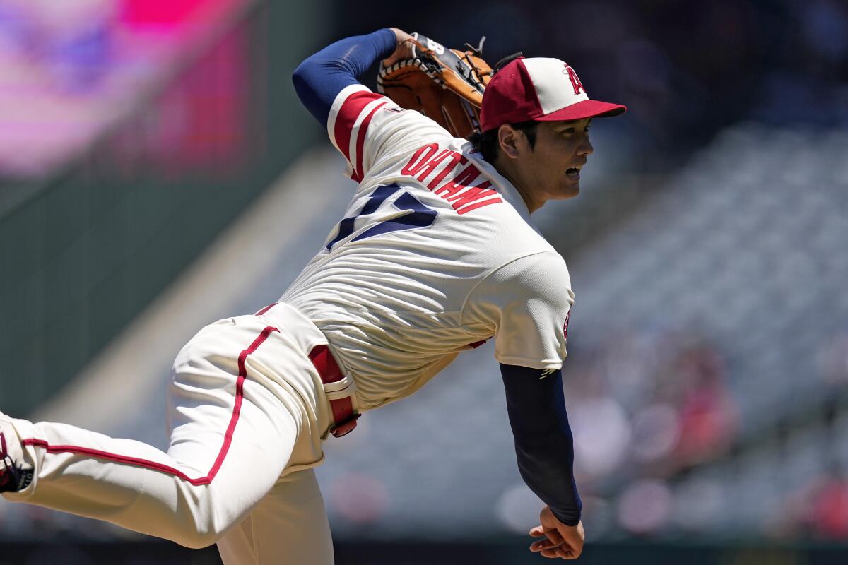 Angels starting pitcher Shohei Ohtani throws to the plate during the first inning against the Reds Wednesday. 