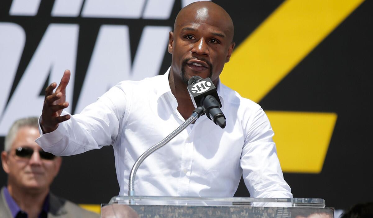Boxing champion Floyd Mayweather Jr. speaks during a news conference at Pershing Square on Thursday to promote his Sept. 13 rematch against Marcos Maidana.