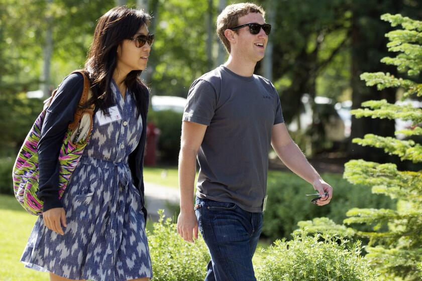 Facebook CEO Mark Zuckerberg and his wife, Dr. Priscilla Chan, in 2011.