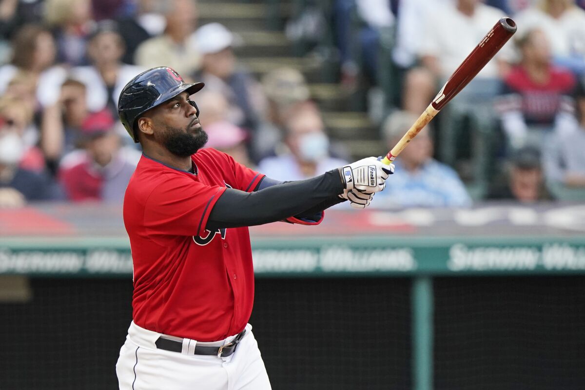 Cleveland Indians' Franmil Reyes watches his two-run home run during the third inning of the team's baseball game against the Minnesota Twins, Thursday, Sept. 9, 2021, in Cleveland. (AP Photo/Tony Dejak)