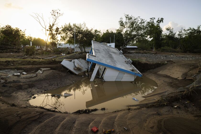 View of a house that was washed away by Hurricane Fiona at Villa Esperanza in Salinas, Puerto Rico, Wednesday, September 21, 2022. (AP Photo/Alejandro Granadillo)