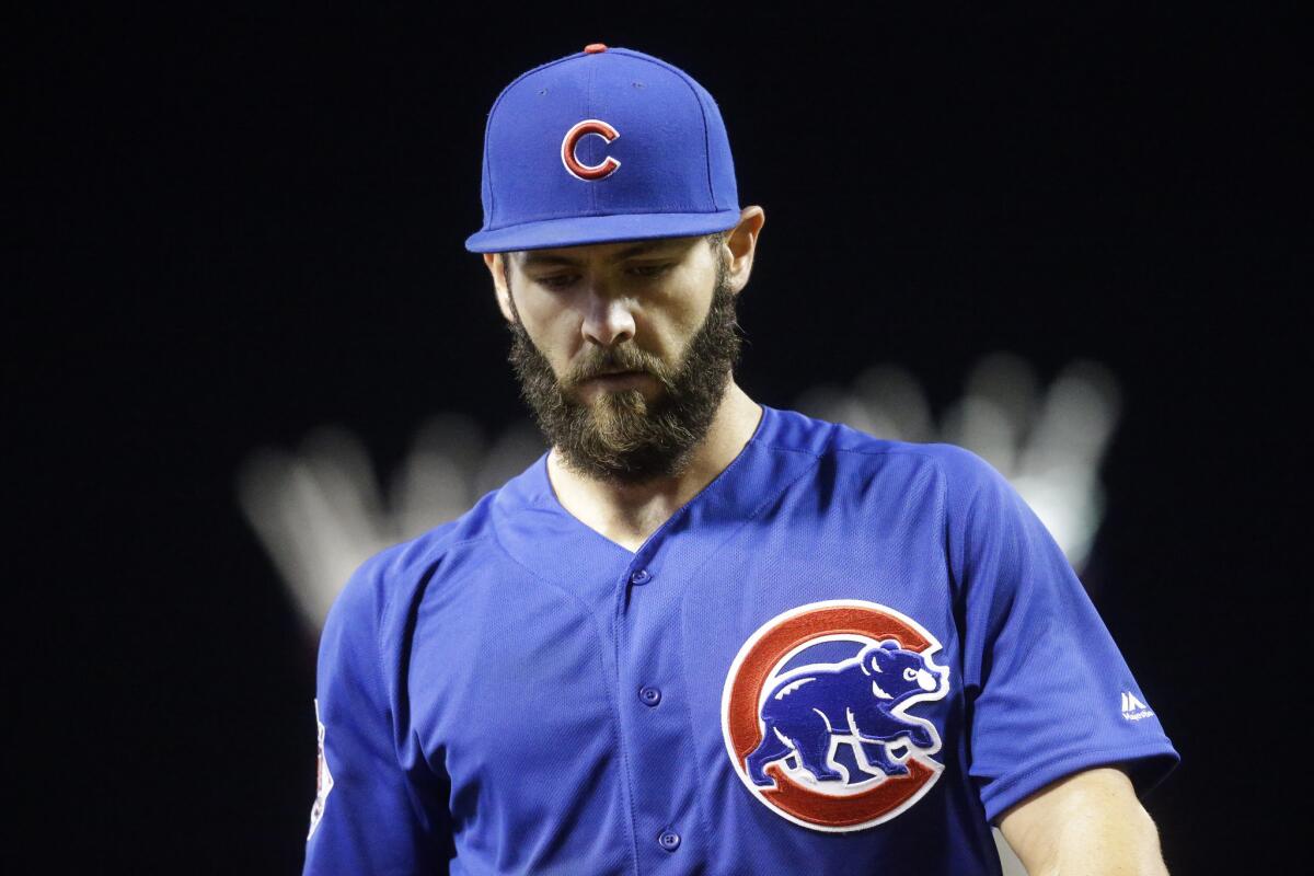 Cubs starting pitcher Jake Arrieta walks off the mound during the eighth inning of of his no-hitter against the Reds on April 21.