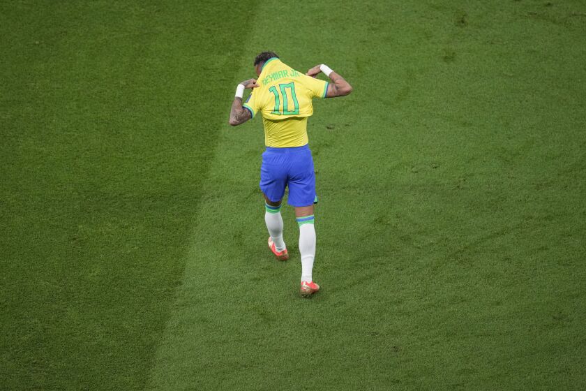 Brazil's Neymar wears his shirt during the World Cup group G soccer match between Brazil and Serbia, at the the Lusail Stadium in Lusail, Qatar on Thursday, Nov. 24, 2022. (AP Photo/Darko Vojinovic)