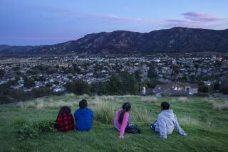 SANTA PAULA, CA-JANUARY 29, 2020: left to right-Celestea Rojas, her cousin George Valencia, cousin Concepcion Valencia, and friend Moises Tomas take in the view of Santa Paula from above. (Mel Melcon/Los Angeles Times)