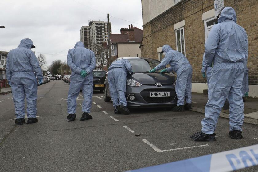 Forensic officers search the scene where a 17-year old girl was shot and died after on Monday evening, in the in Tottenham district of north London, Tuesday morning April 3, 2018. Later, police in nearby Walthamstow found two young victims suffering from gun shot and knife wounds. The homicide rate in London has increased each month in 2018 as the British capital experiences a rise in violent crime. (Jonathan Brady/PA via AP)