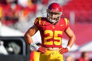 USC linebacker Tackett Curtis stands with his hands on his hips and looks up field during the Trojans' season opener