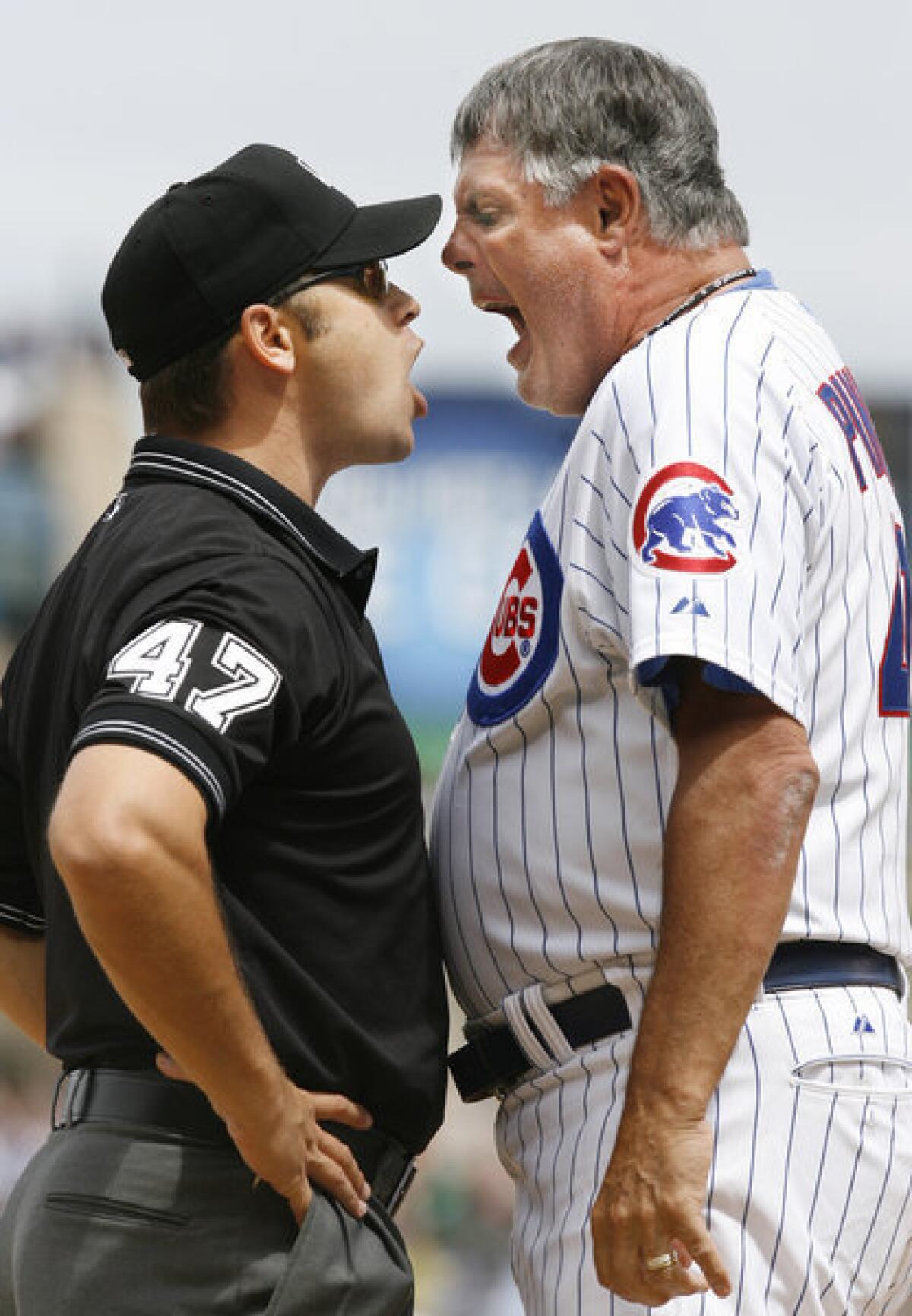 Then-Chicago Cubs Manager Lou Piniella argues with umpire Mark Wegner in 2007. Piniella was ejected by Wegner.