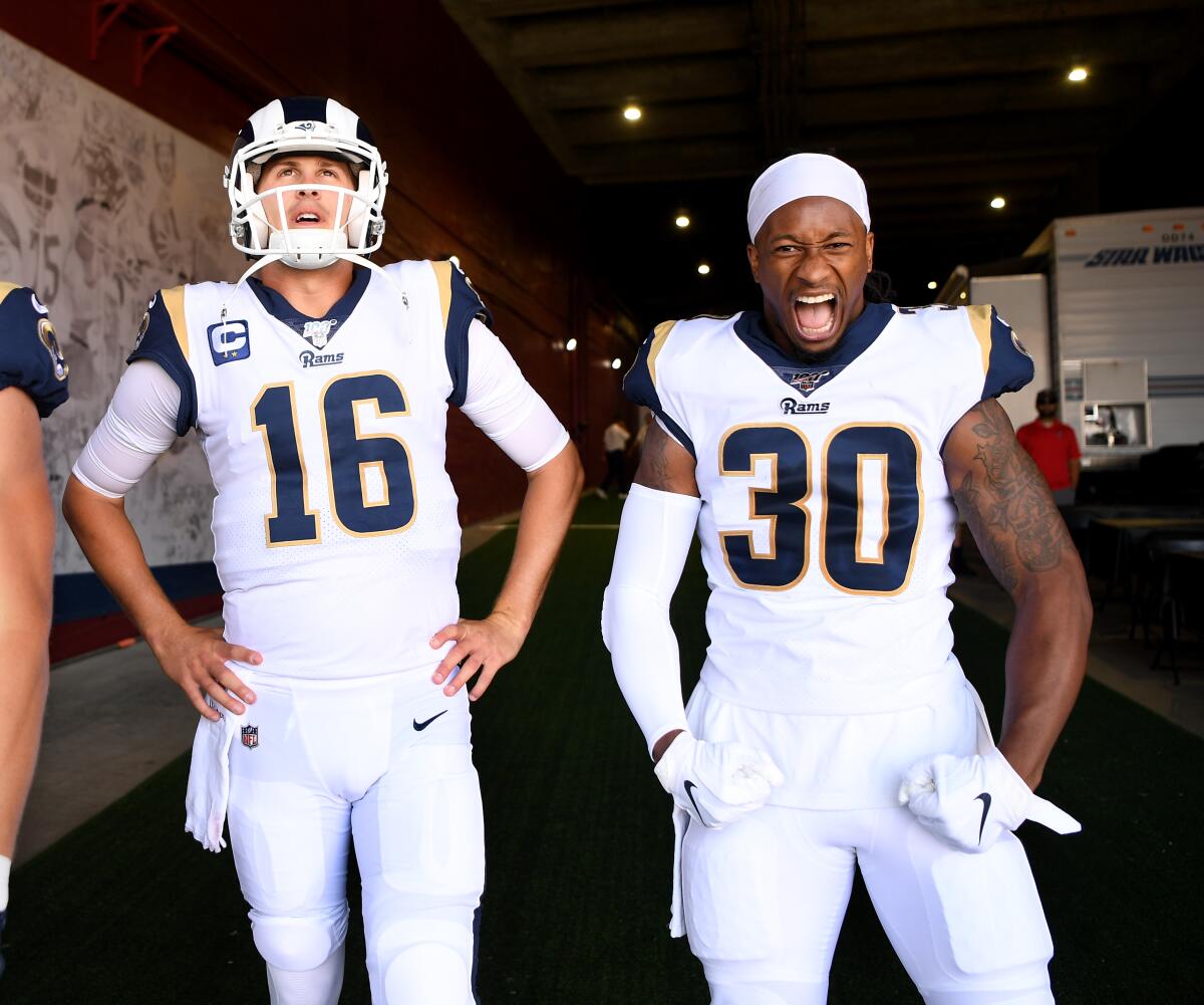Rams quarterback Jared Goff (16) and running back Todd Gurley prepare to take the field in 2019.