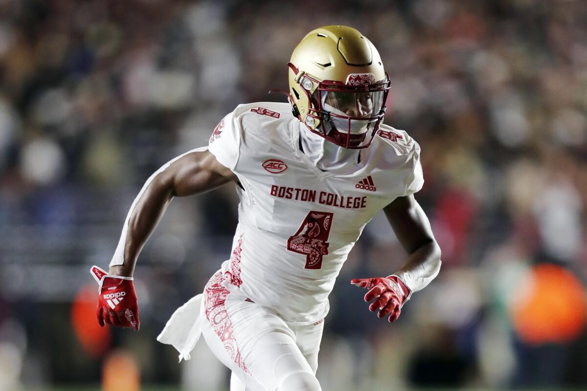 FILE - Boston College wide receiver Zay Flowers (4) plays against Virginia Tech during the first half of an NCAA college football game on Nov. 5, 2021, in Boston. Boston College opens the 2022 season against Rutgers on Sept. 3. (AP Photo/Michael Dwyer, File)