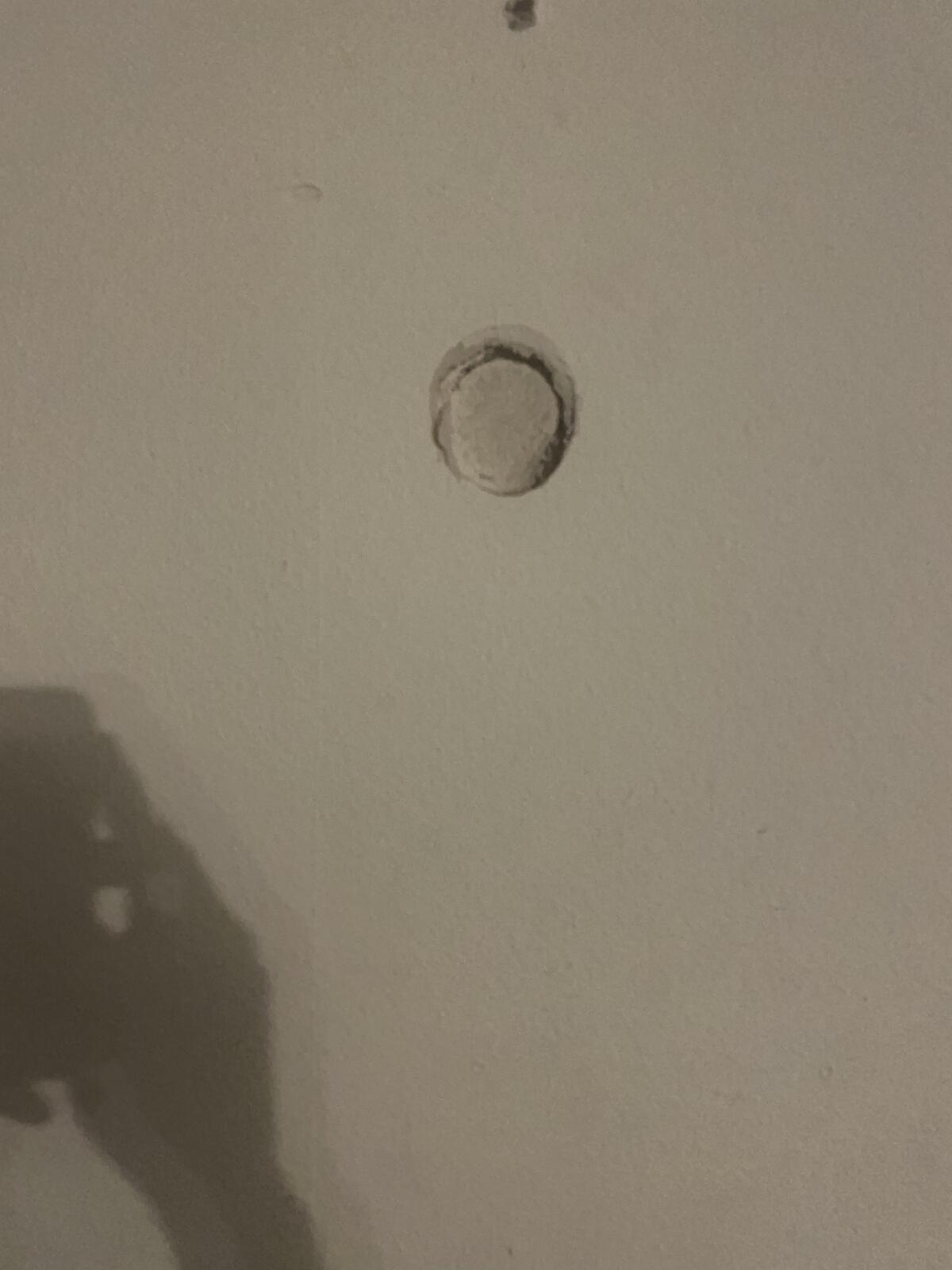 The hole in the wall in the living room from Diego Velazquez practicing his hitting.