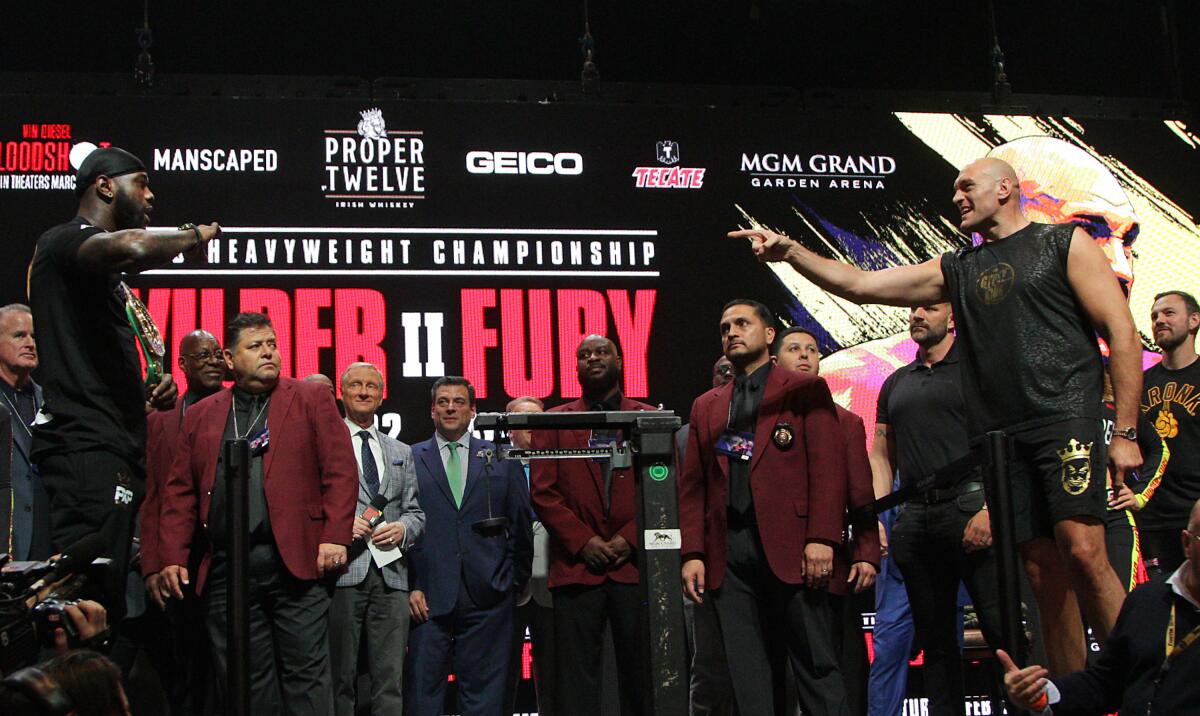 Deontay Wilder and Tyson Fury face off during their official weigh-in at the MGM Grand Las Vegas. 