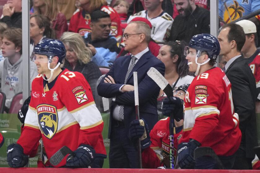 Florida Panthers coach Paul Maurice watches during the second period of the team's NHL hockey game against the New York Islanders Thursday, March 28, 2024, in Sunrise, Fla. (AP Photo/Jim Rassol)