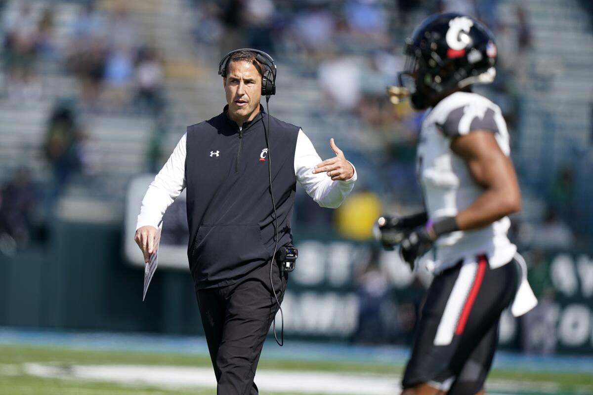 Cincinnati coach Luke Fickell talks with his players during a game against Tulane Saturday