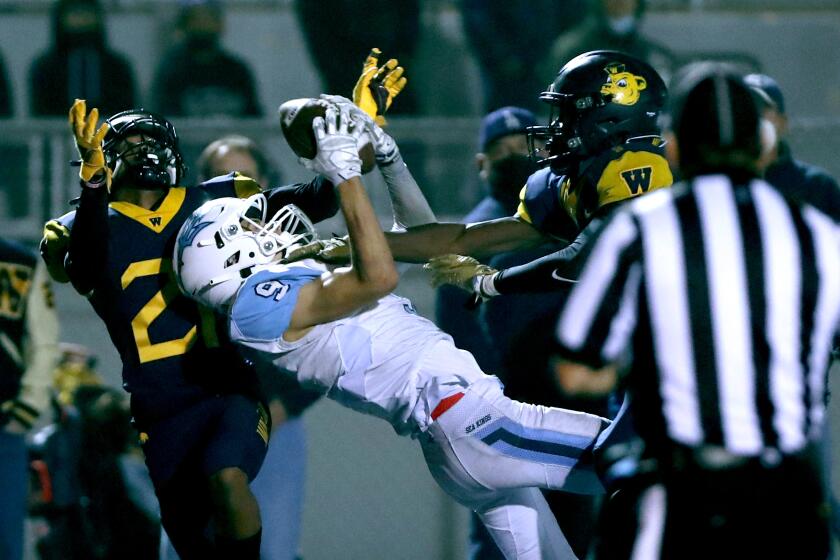 Corona Del Mar #9 Cooper Hoch catches a Hail Mary pass to seal the win late in the 4th quarter in away game vs. Downey Warren, in the 1st round of CIF Southern Section Div. 2 playoff game, in Downey on Friday, Nov. 5, 2021. CDM won 42-35.